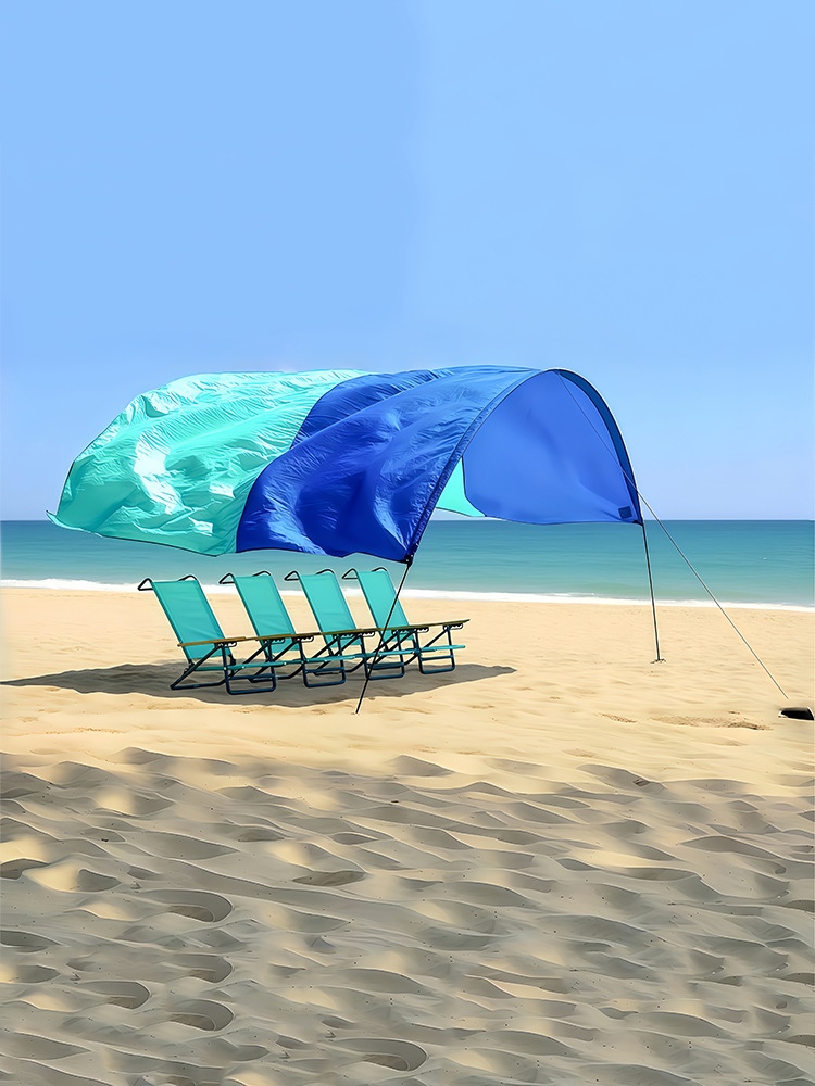 Toldo para tienda de playa con despliegue automático eólico
